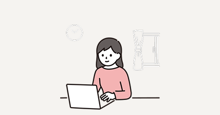 自宅でノートパソコンを使い仕事・作業をしている女性